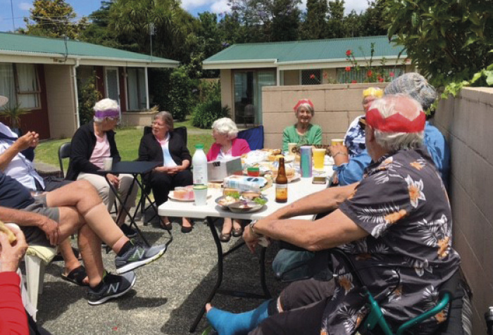 Windsor Court tenants in Mairangi Bay had fun singing carols and sharing Christmas cracker jokes