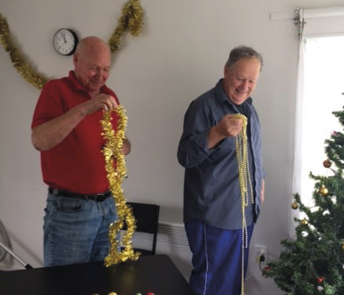 Tenants John and Andrew of Flagstaff Court in Massey had fun getting their community house ready for the Christmas party